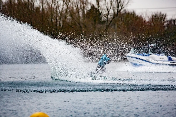 Image of a person wakeboarding behind a boat